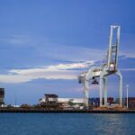 https://www.pexels.com/photo/industrial-port-with-cargo-cranes-at-twilight-34578903/