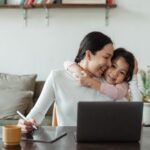 https://www.pexels.com/photo/cute-little-ethnic-girl-embracing-working-mother-4474036/