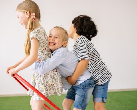 https://www.pexels.com/photo/two-girls-and-a-boy-having-fun-8613065/