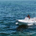 https://www.pexels.com/photo/man-on-motorboat-on-sea-20300496/